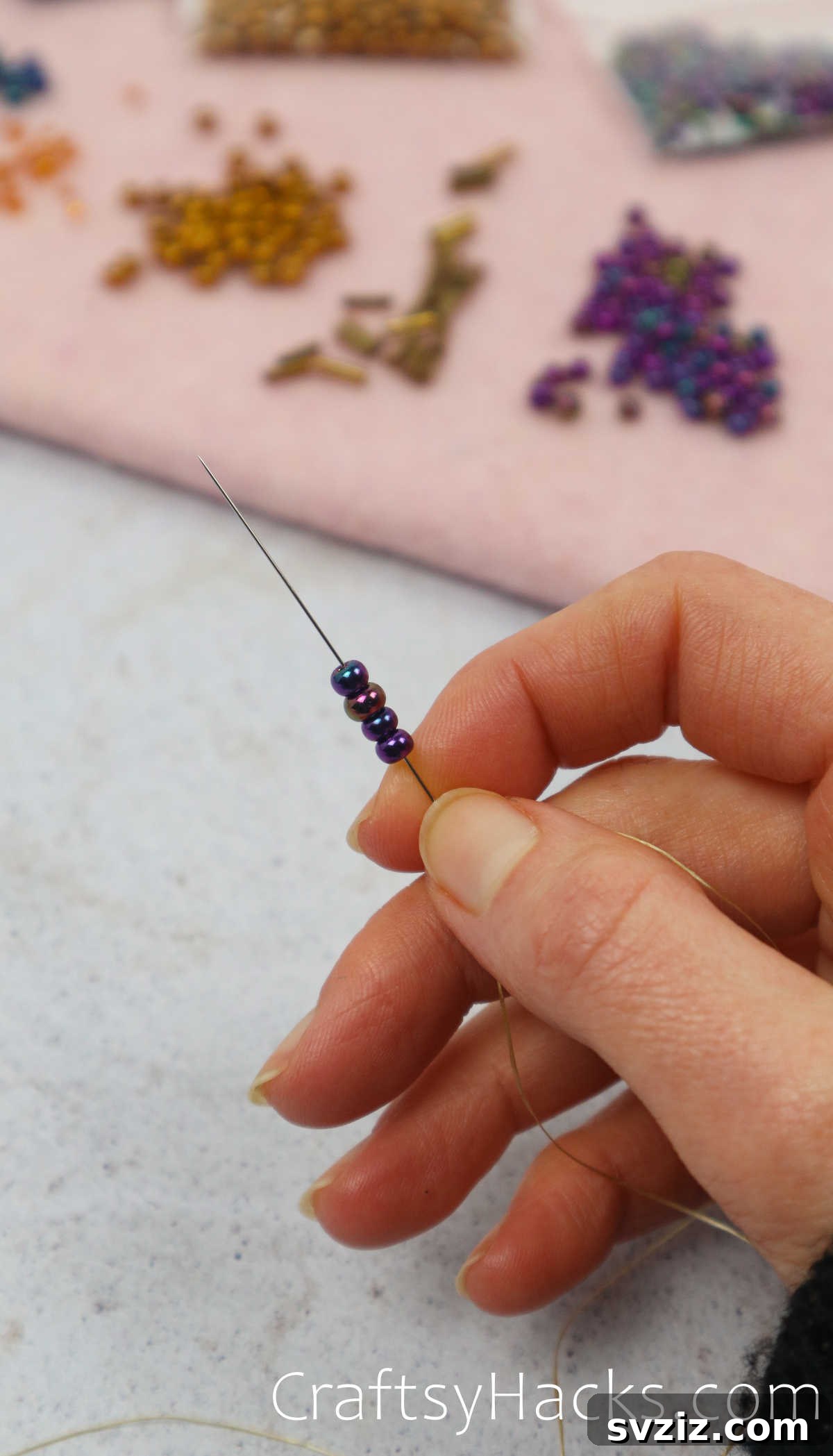 Craft Your Own Beaded Earrings 7 Beading needle threaded with four seed beads, ready to form the base.