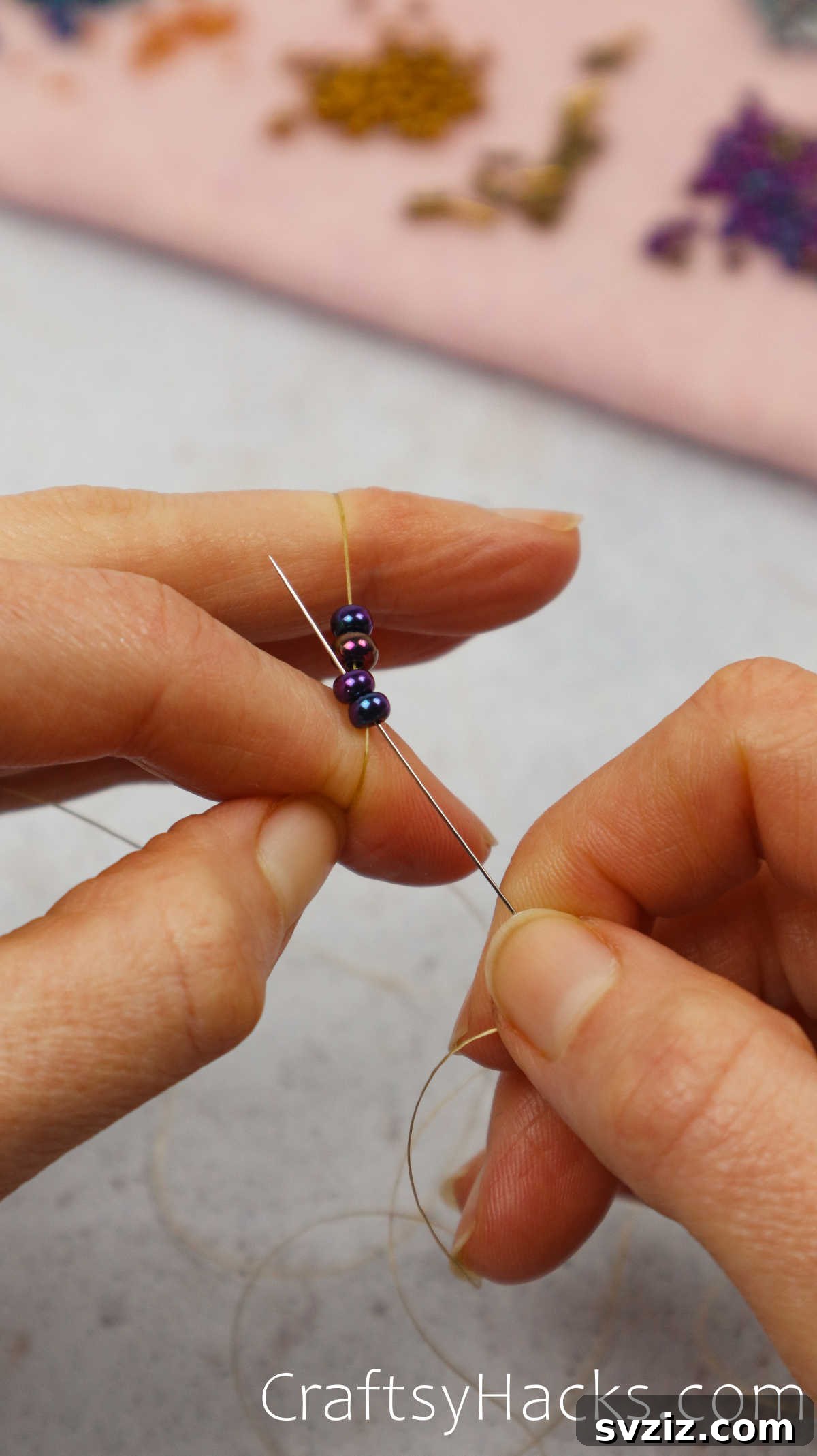 Craft Your Own Beaded Earrings 9 Beading needle being threaded back through two beads to create a ladder stitch.