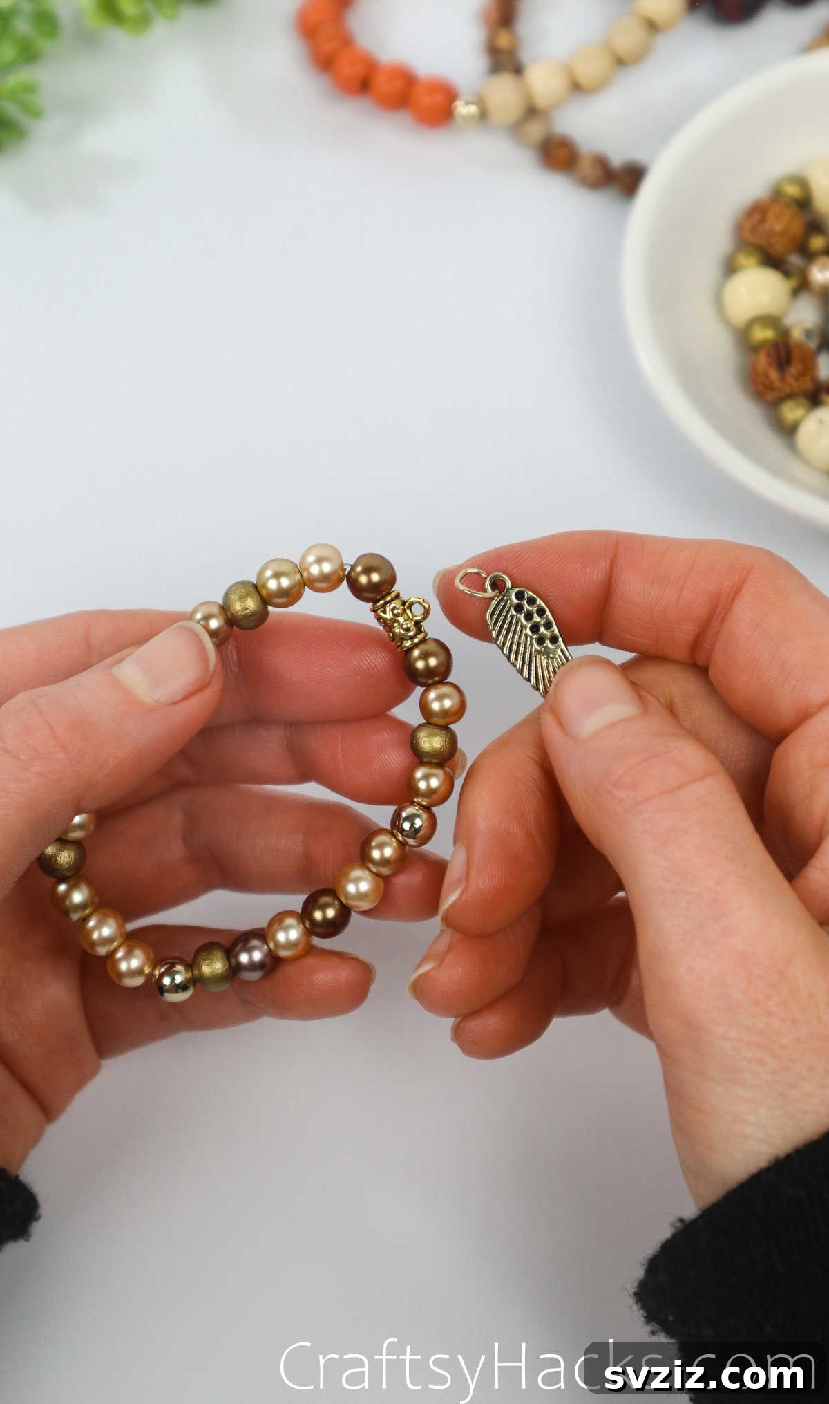 Craft Your Own Stylish Beaded Bracelets 31 add charm to bracelet