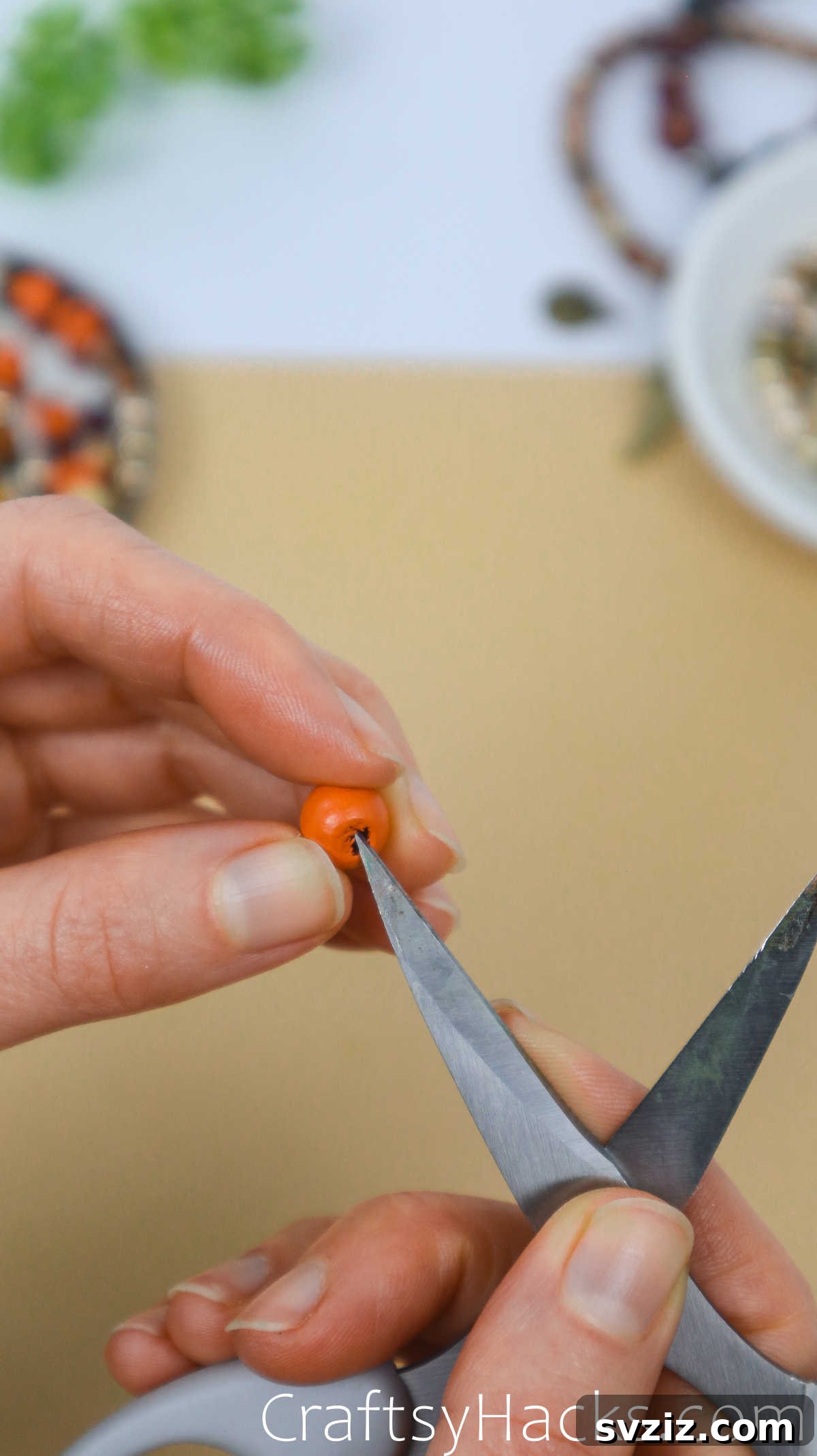 Craft Your Own Stylish Beaded Bracelets 7 widen hole in beads with scissors