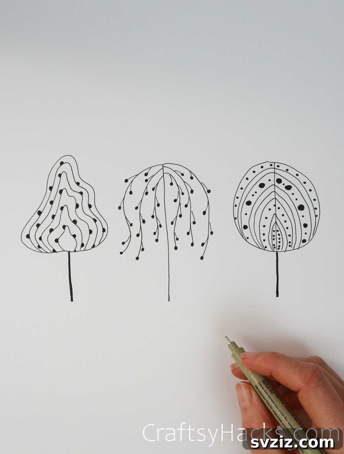 21 Simple Tree Drawing Prompts 4 Close-up of three simple tree drawings, illustrating minimalist tree art
