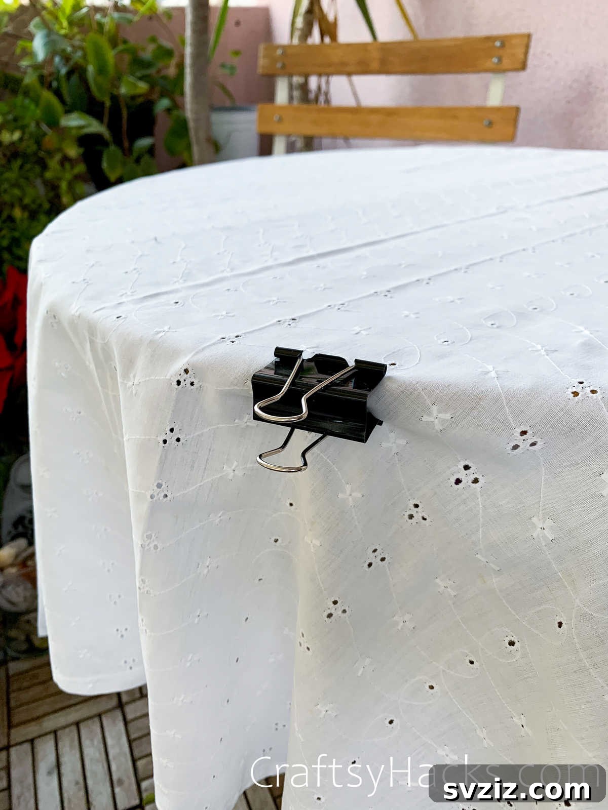Binder clips holding a tablecloth securely in place on a table