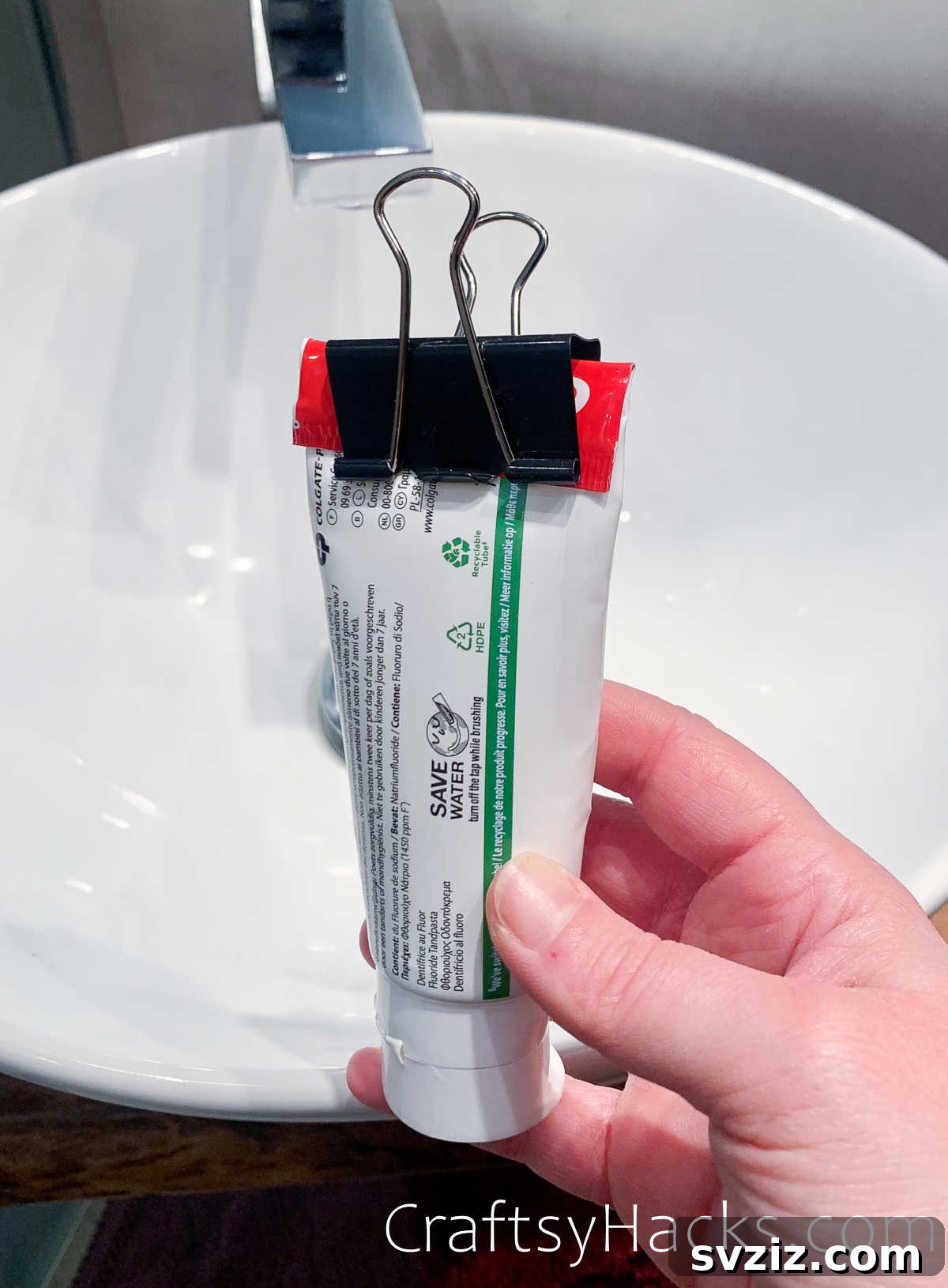 Binder clip used to squeeze out remaining toothpaste from a tube