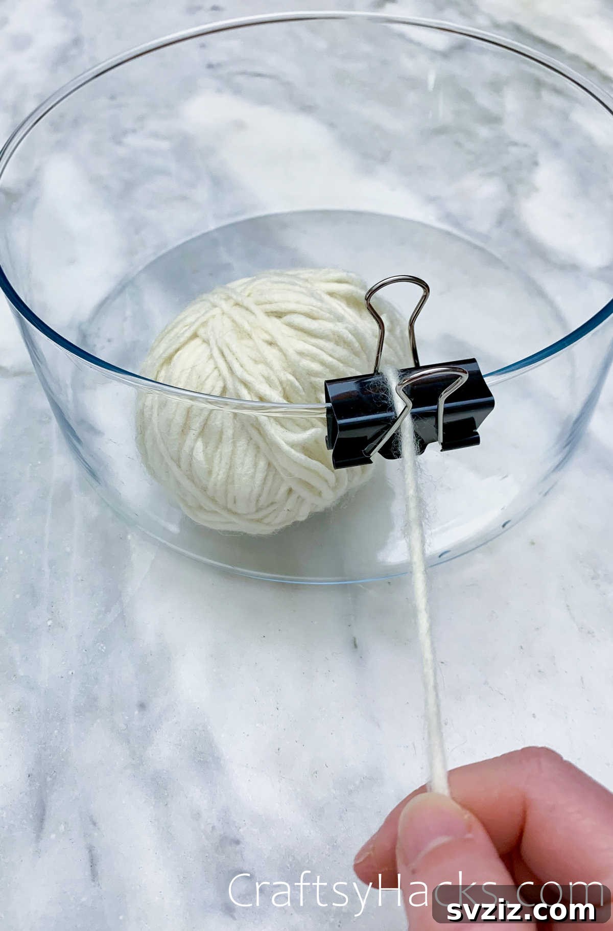 Binder clip used with a bowl to keep yarn or string tangle-free while crafting