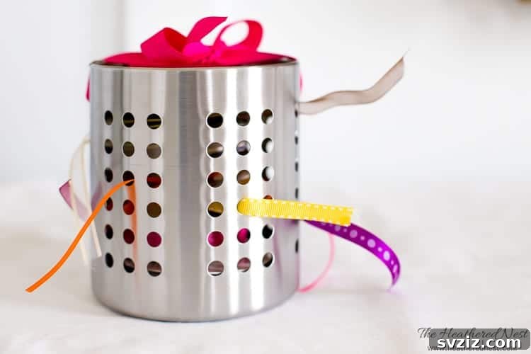 21 Brilliant Budget Organizing Hacks 12 ribbon organizer using plastic cups in a container for easy dispensing