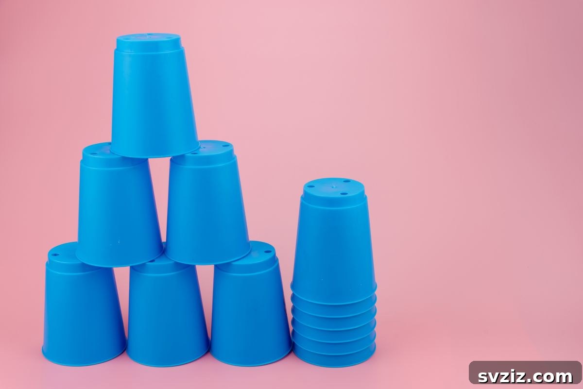 Children playing a STEM cup game, building structures collaboratively
