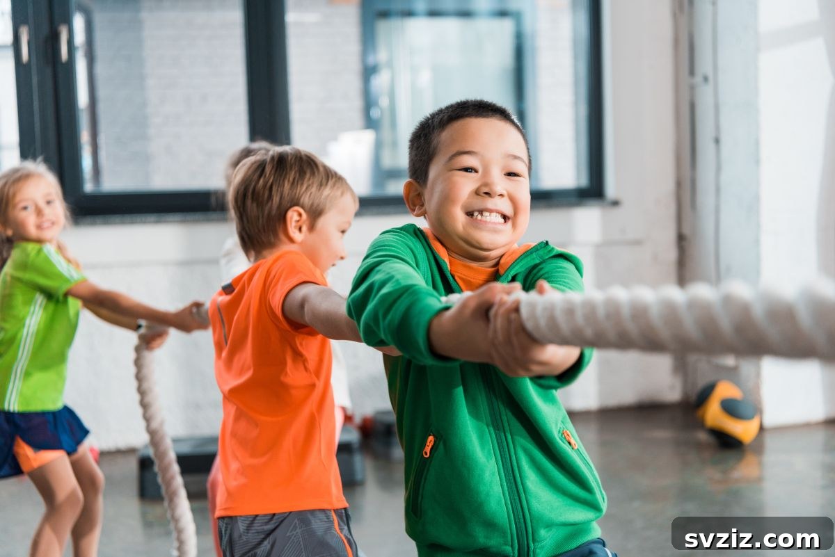 Children playing tug of war, a classic team building game outdoors