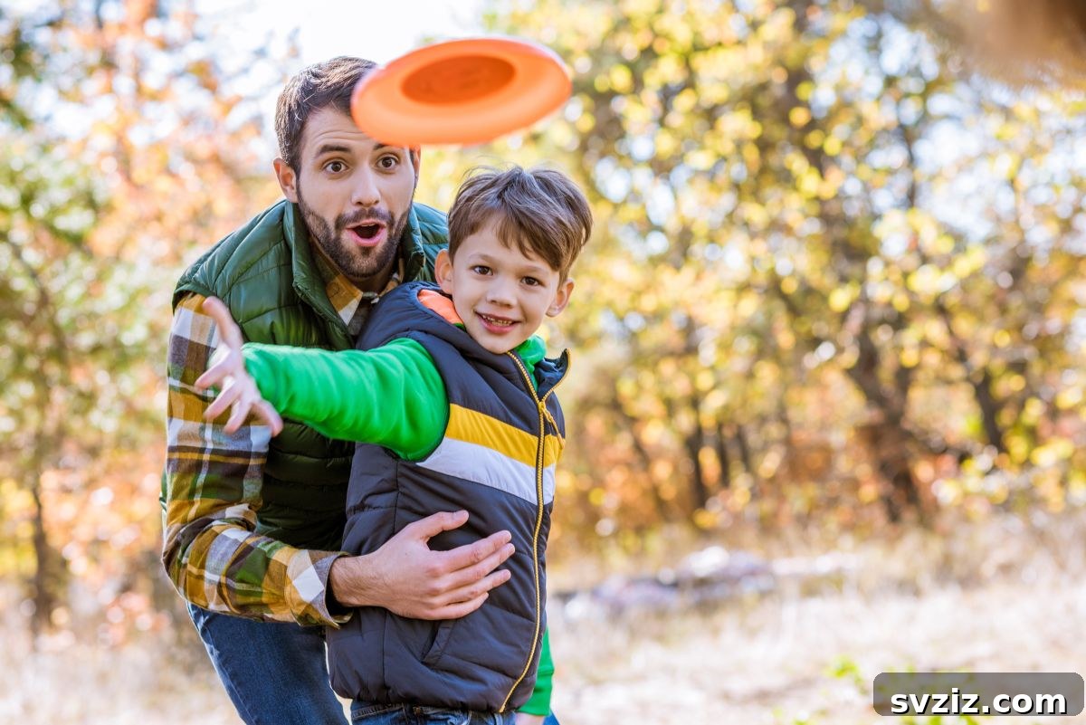 Two people throwing a frisbee in a sunny backyard