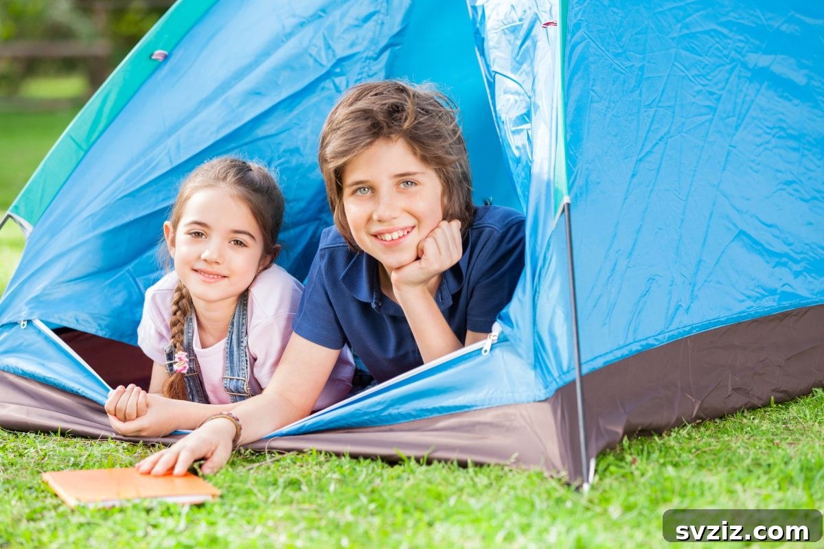 Family camping in a tent in their backyard