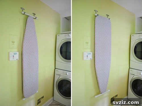 Ironing board with a custom cover hanging on a wall