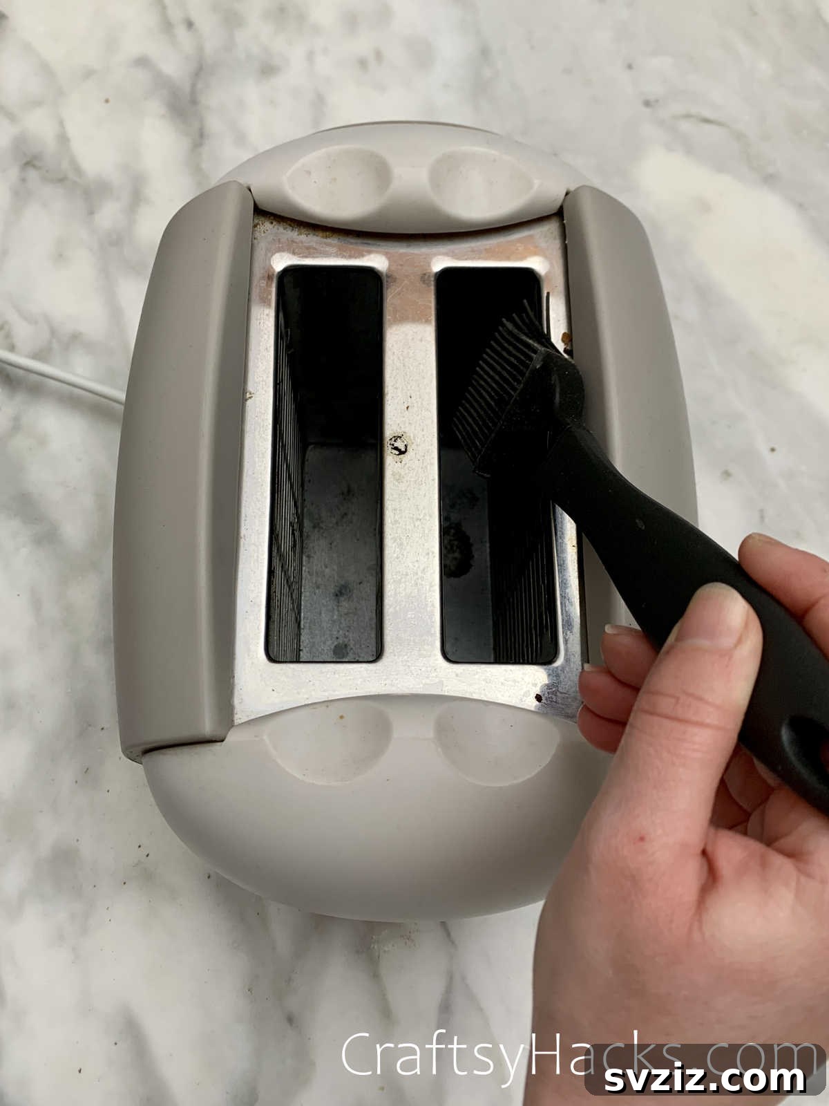 clean toaster with a pastry brush