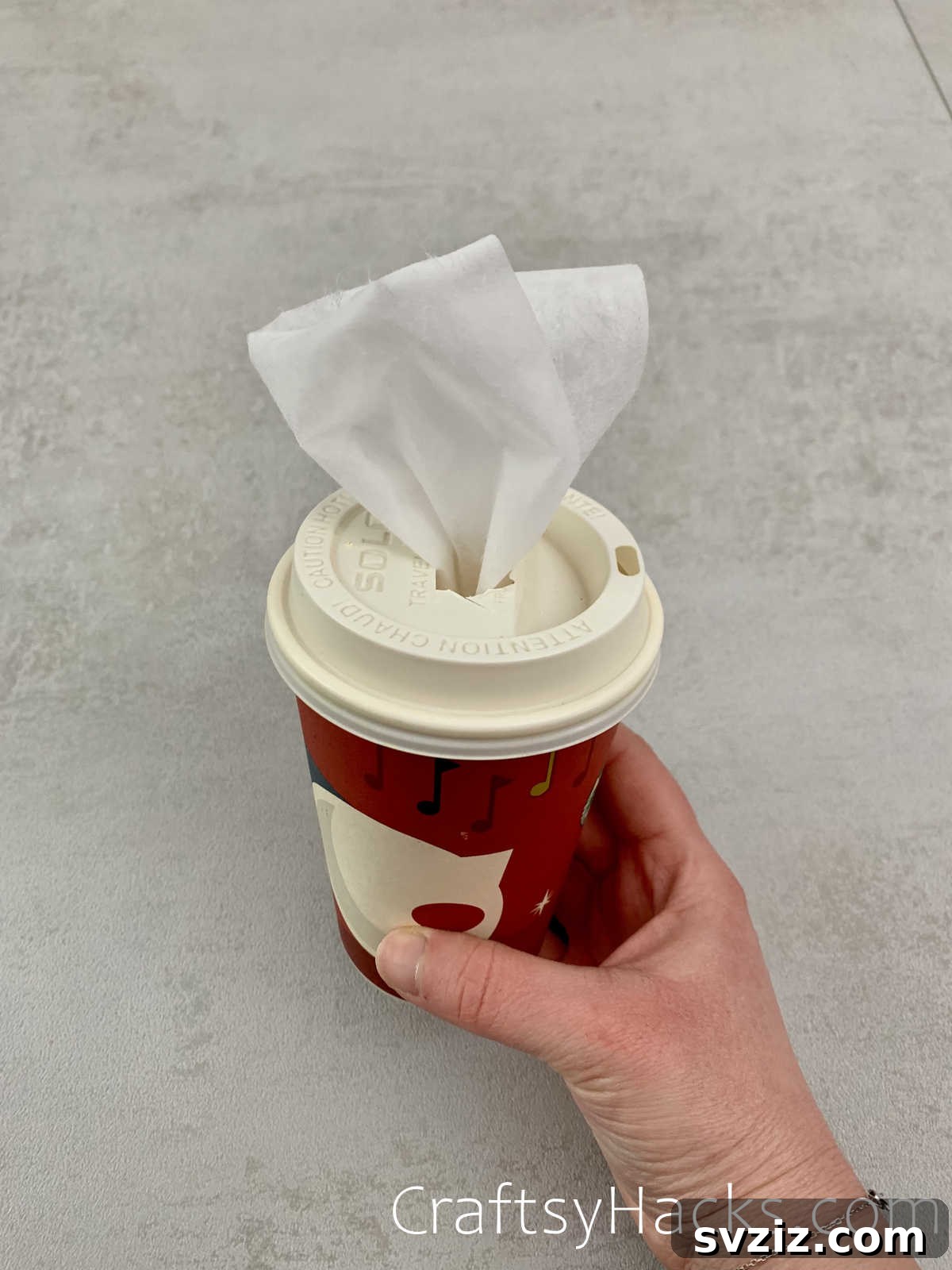 13 Clever Car Detailing Secrets 11 DIY Car Tissue Dispenser from Coffee Cup
