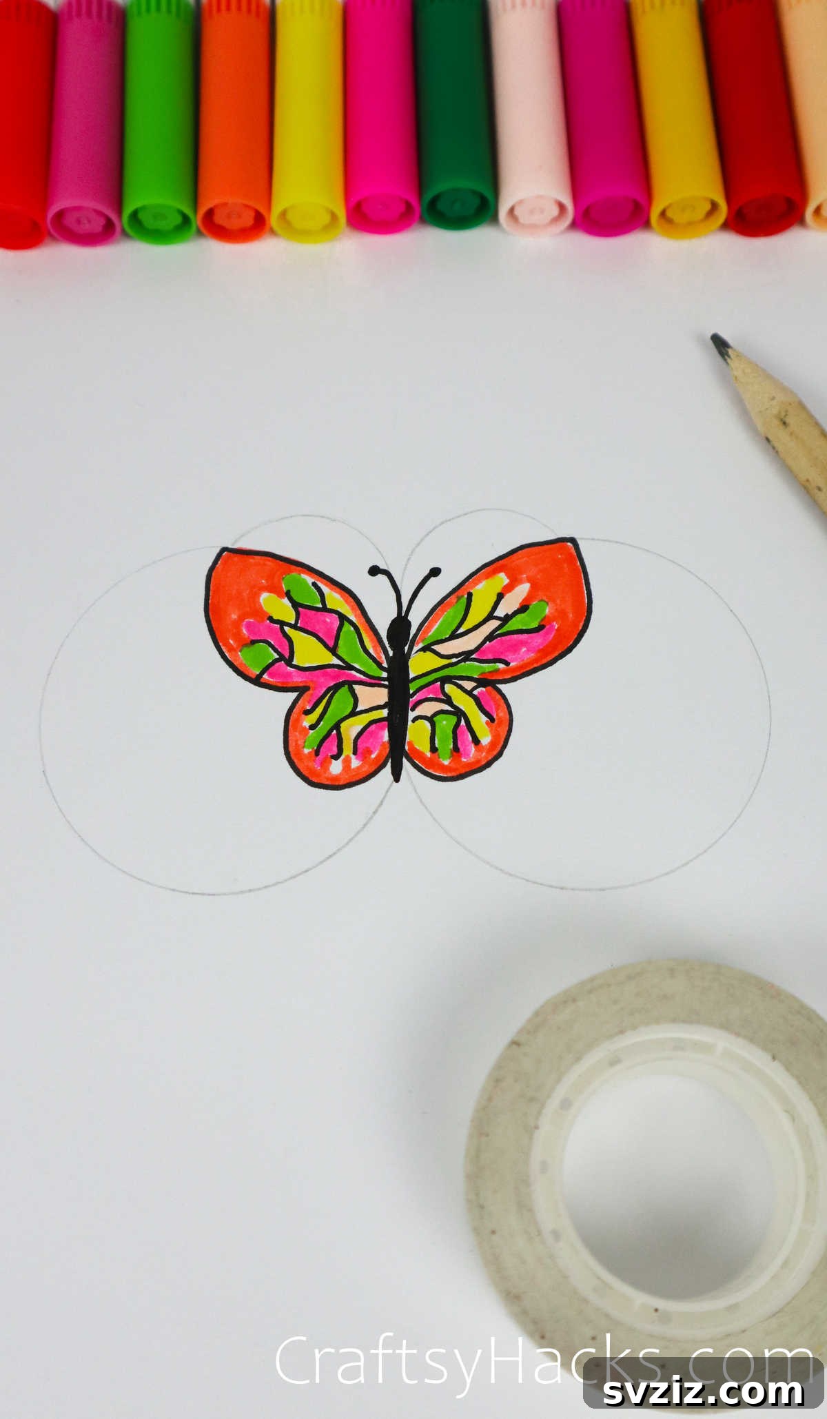 Innovative drawing hack to create a butterfly using tape rolls as templates.