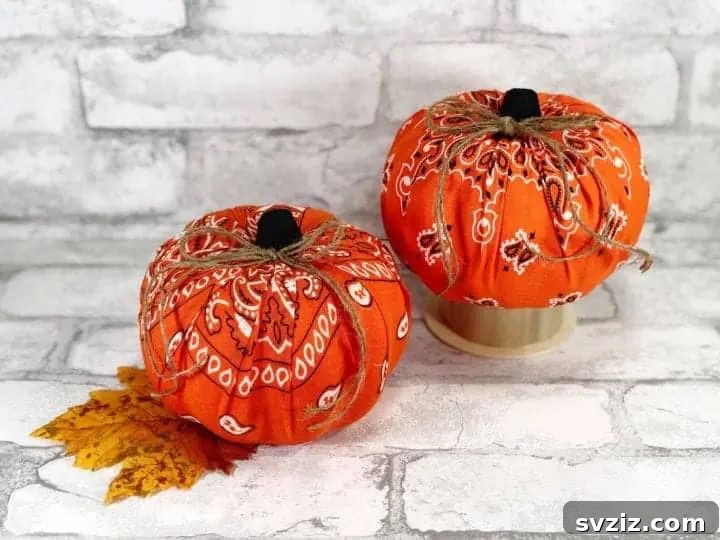 A charming collection of handmade cloth pumpkins in various fall colors and textures, perfect for seasonal home decor.