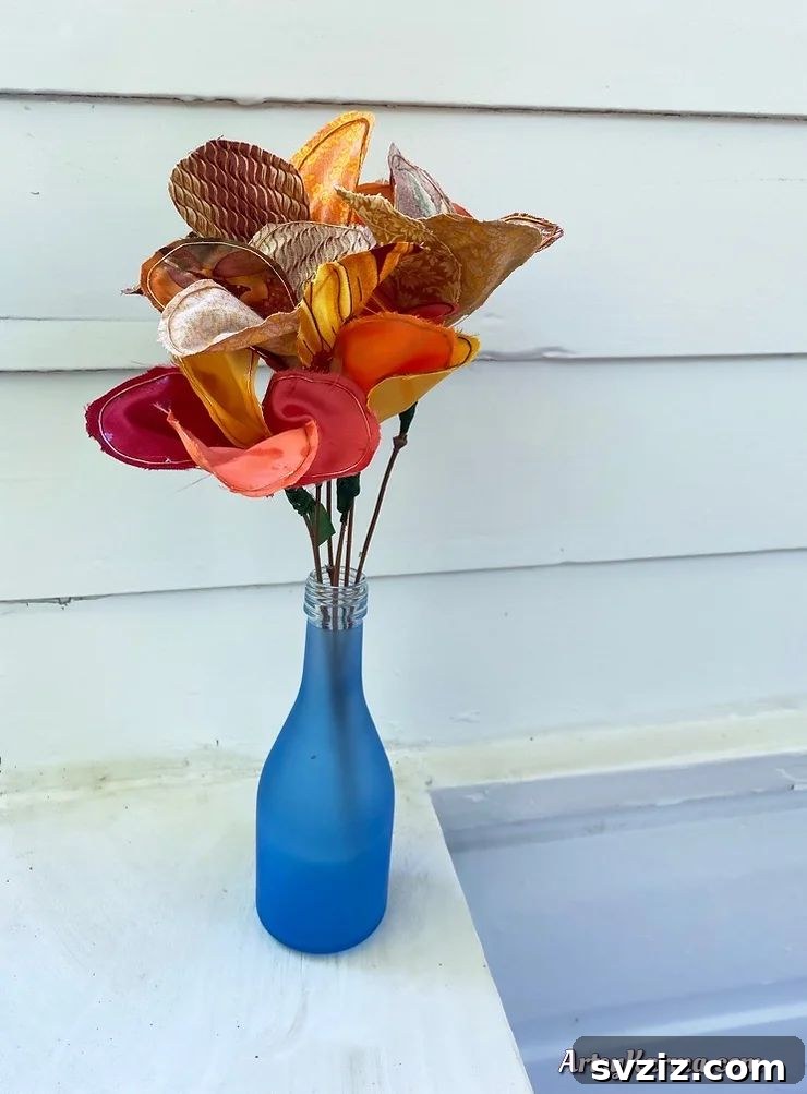 A vibrant assortment of DIY fabric flowers in various shapes and sizes, crafted from colorful textiles, showcasing intricate details and textures.
