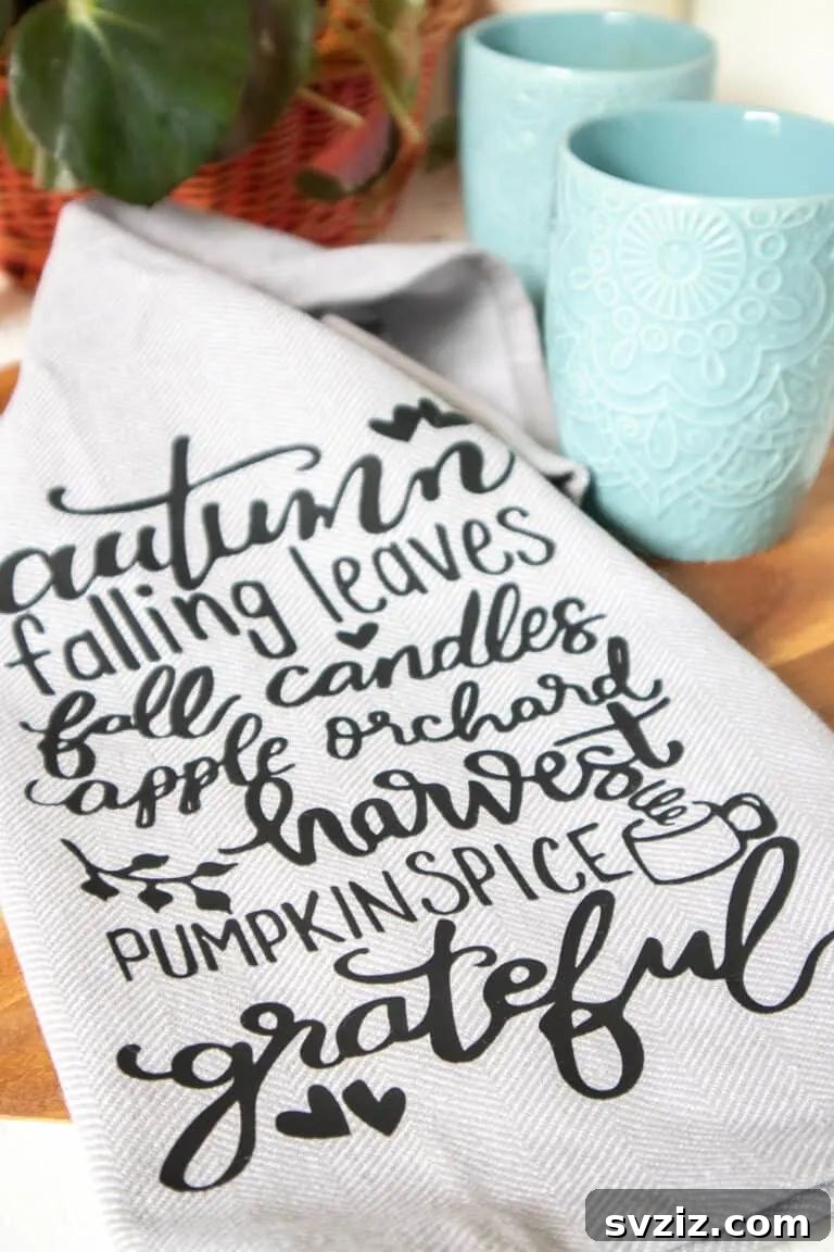 A festive DIY fall tea towel featuring a personalized design created with a Cricut machine, showcasing autumn-themed text and graphics.