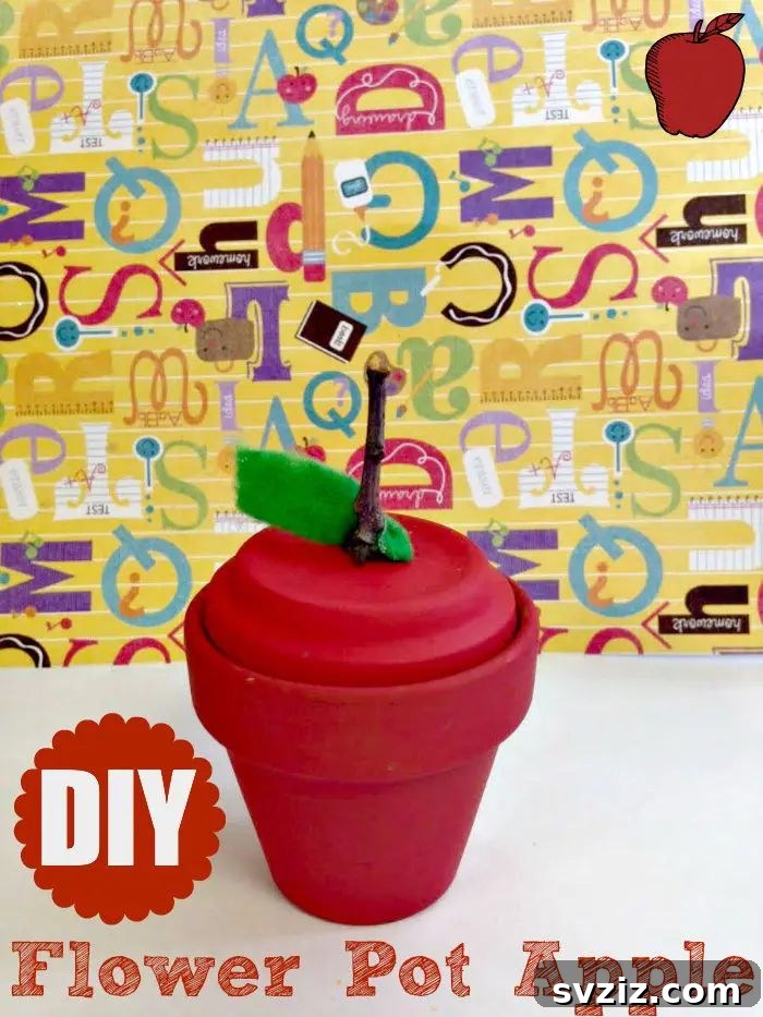 A creative flower pot apple craft, where an inverted terracotta pot is painted red and decorated to resemble a whimsical apple.