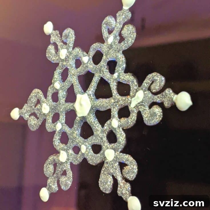 Instant Holiday Cheer: 31 Crafts in Under 15 Minutes 19 DIY snowflake window clings for festive decor
