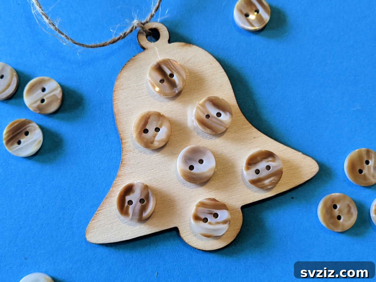 Wooden Holiday Magic: 21 Craft Ideas 22 DIY rustic bell craft decorated with buttons and fabric for holiday charm