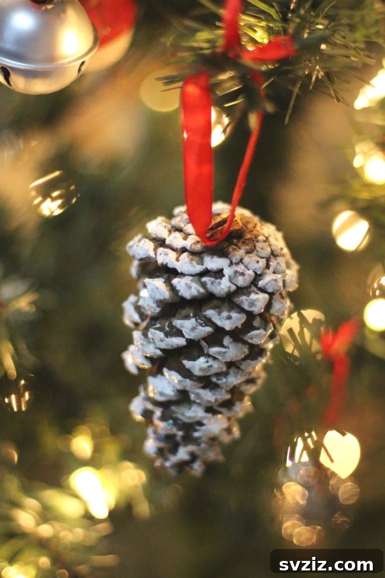 Natural snowy pinecone ornaments with a frosted winter look.