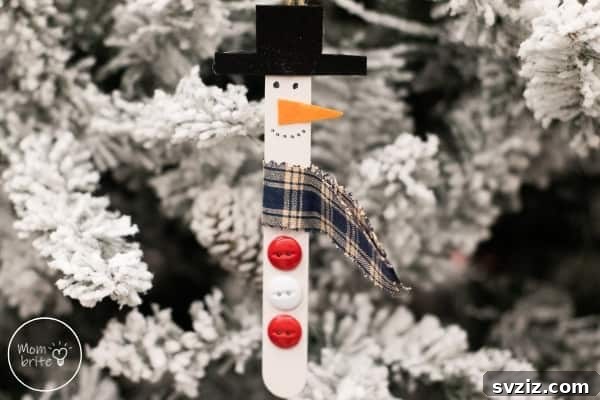Cute popsicle stick snowman ornaments, a perfect kid's craft.