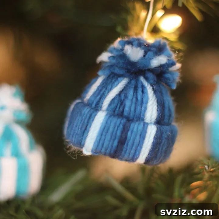 Charming miniature yarn hat ornaments for a cozy Christmas tree.