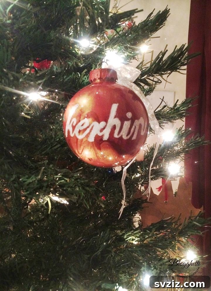 Vibrant pour-painted Christmas ornaments with unique abstract designs.