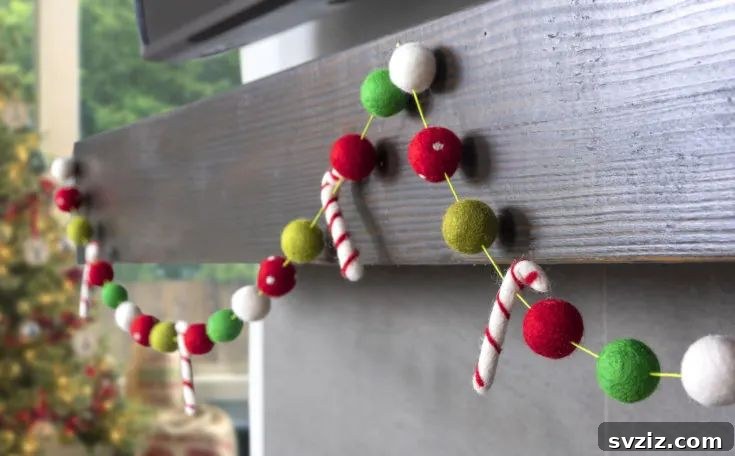 31 Festive DIYs to Deck Your Living Room This Christmas 17 Vibrant felt ball Christmas garland, adding a pop of color and playful texture to holiday decor.