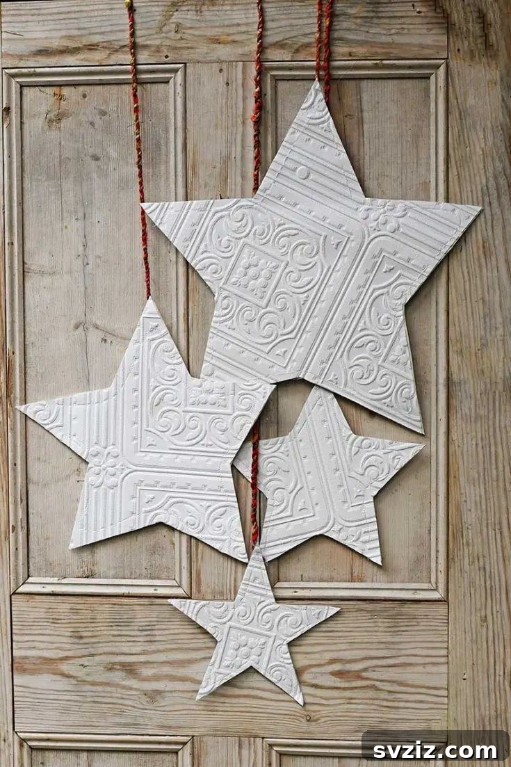 31 Festive DIYs to Deck Your Living Room This Christmas 29 Handmade Christmas paper stars, adding celestial elegance to holiday home decor.
