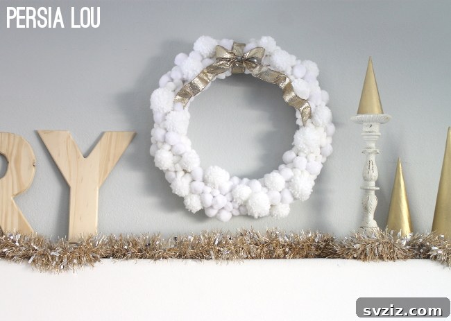 31 Festive DIYs to Deck Your Living Room This Christmas 31 Whimsical snowball wreath, adding a snowy, wintry touch to Christmas door decor.