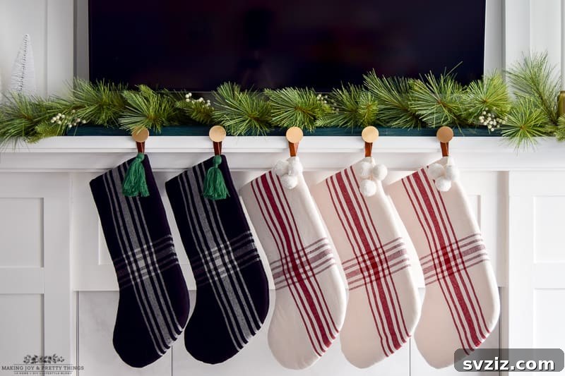 31 Festive DIYs to Deck Your Living Room This Christmas 6 Stylish modern Christmas stocking holder design, perfect for contemporary holiday decor.