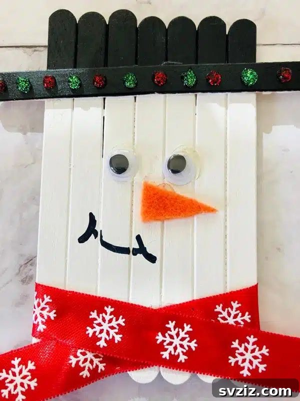 31 Fun Winter Craft Ideas for Little Ones 13 Popsicle Stick Snowman Craft: Easy DIY Winter Decor for Kids