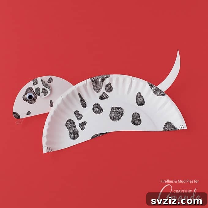 Playful paper plate Dalmatian craft with black spots, ears, and googly eyes, perfect for dog lovers and encouraging imaginative play.