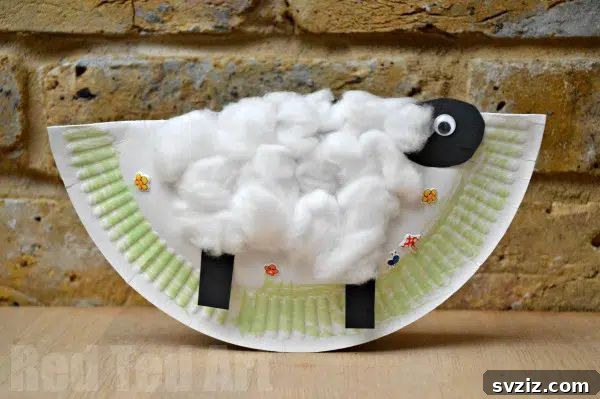 Adorable rocking paper plate sheep craft for kids, made from a folded paper plate and cotton balls, creating a fun toy.