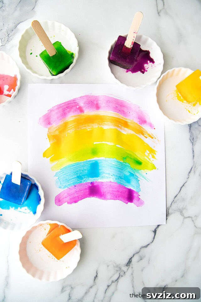 Cool and creative ice painting activity for kids, using frozen colored ice cubes on paper for a unique melting art experience.