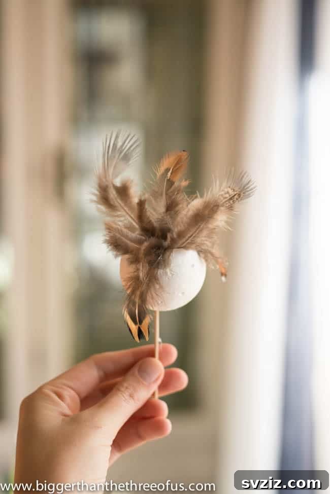 41 Brilliant Feather Projects 8 feather ball ornament