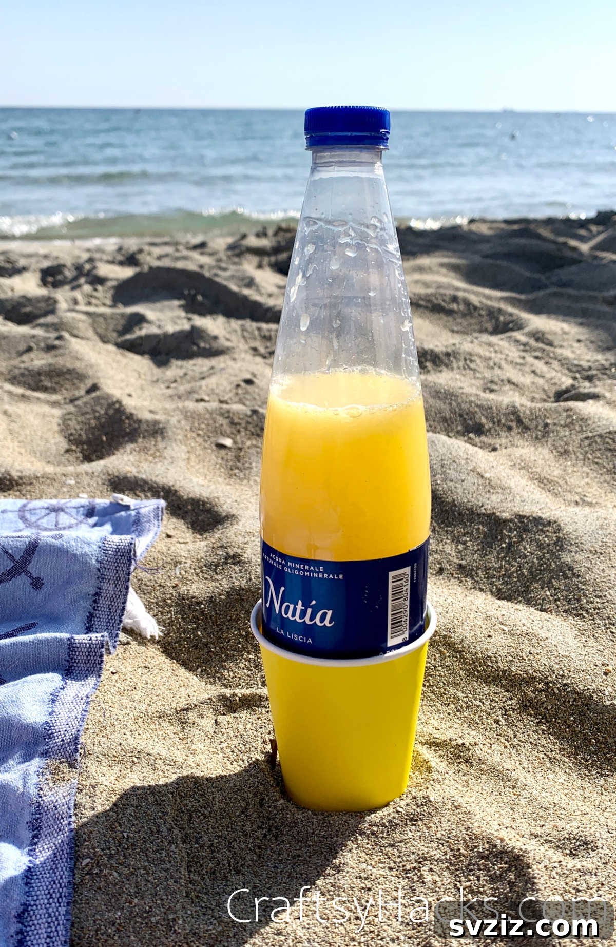 21 Game-Changing Beach Hacks for Your Next Trip 6 use paper cups to prevent sand from sticking to a bottle