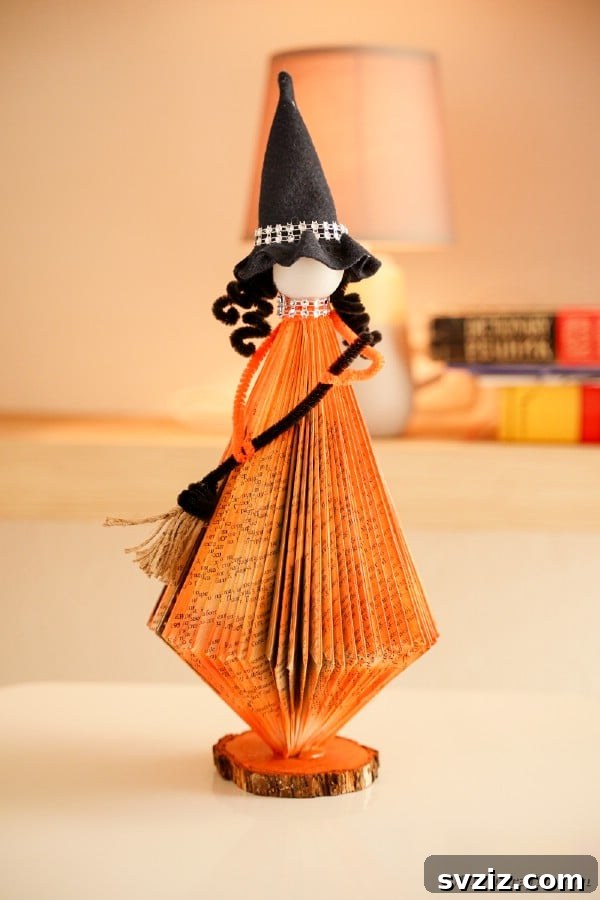 Charming and Eerie Witch Craft Projects 14 A creative floating witch decoration made from old books.
