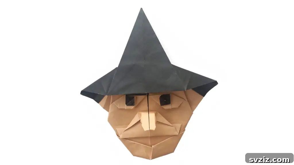 Charming and Eerie Witch Craft Projects 17 A minimalist and sleek origami witch design.