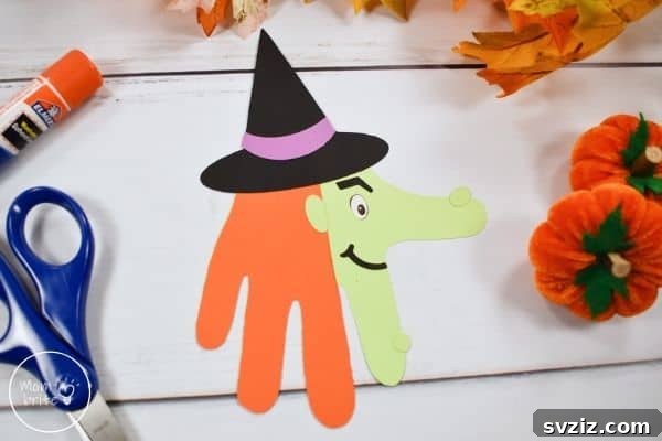 Charming and Eerie Witch Craft Projects 27 A friendly witch handprint craft with a purple hat and green hand.