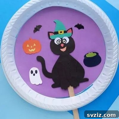 Charming and Eerie Witch Craft Projects 42 A paper plate black cat with a witch hat, a simple Halloween craft.
