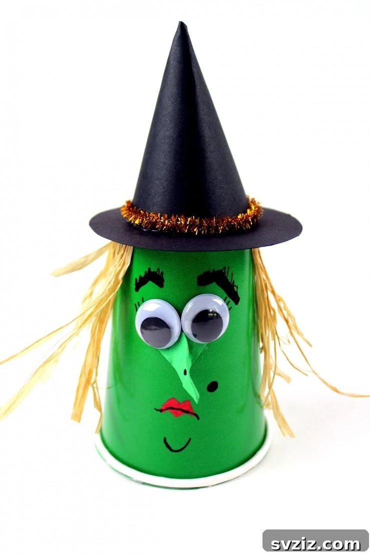 Charming and Eerie Witch Craft Projects 8 Halloween treat cups decorated as witches with green faces and witch hats.