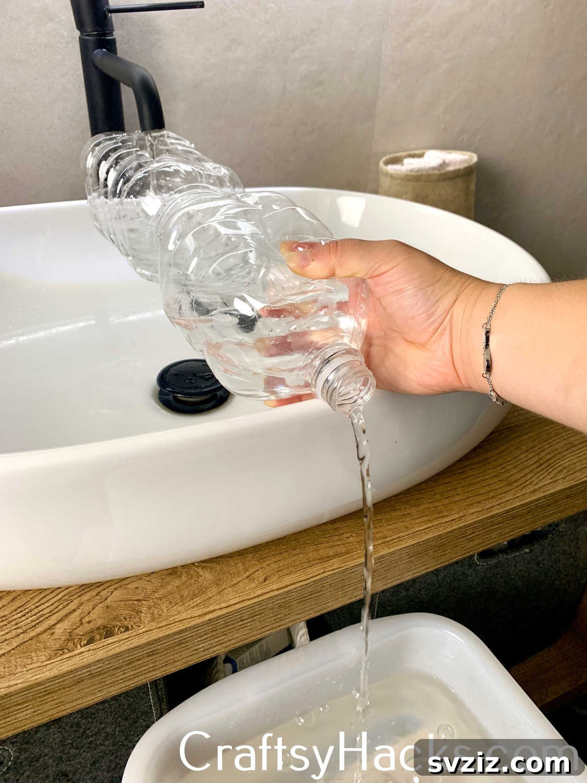 Use an empty plastic bottle as a funnel or extender to easily fill oversized basins, buckets, or pet bowls from a standard sink faucet, preventing spills and making awkward tasks simpler.