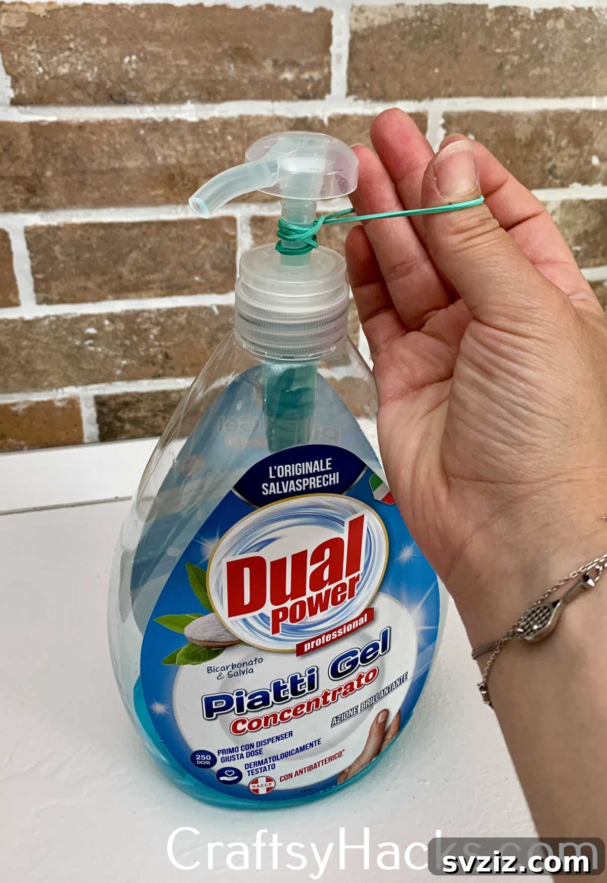 Wrap an elastic band around a liquid soap dispenser's pump to limit the amount of soap dispensed per push, reducing waste and making soap last longer, ideal for households with children.
