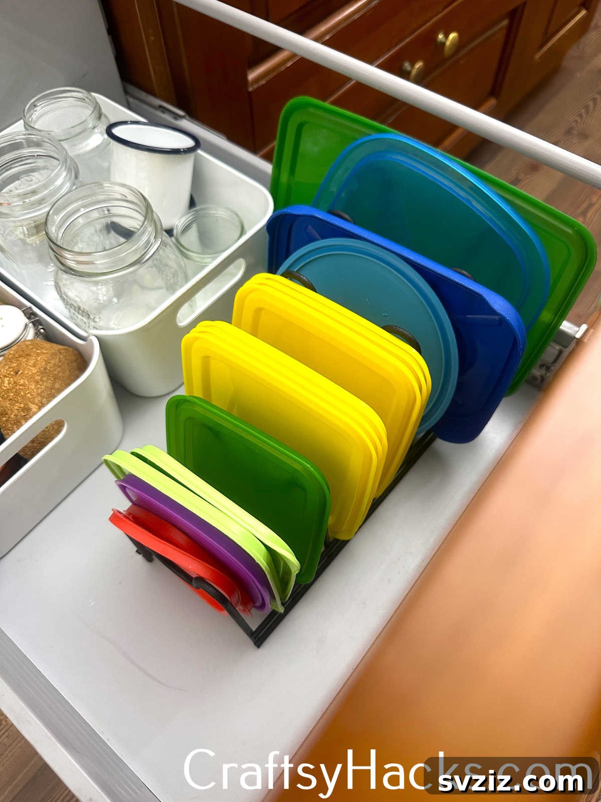 Organize kitchen cabinets by sorting plastic food storage lids by size for easy matching with containers.