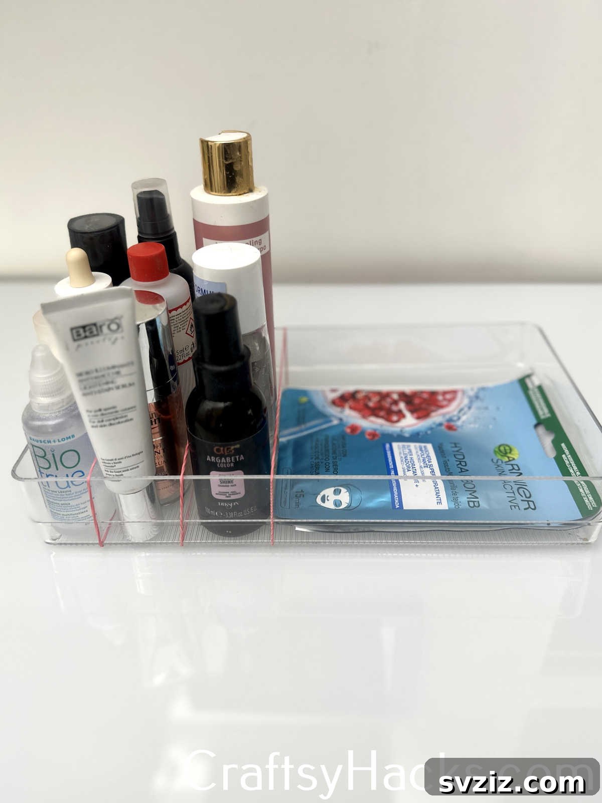 Keep cosmetic products upright in drawers or containers using rubber bands for added stability and organization.