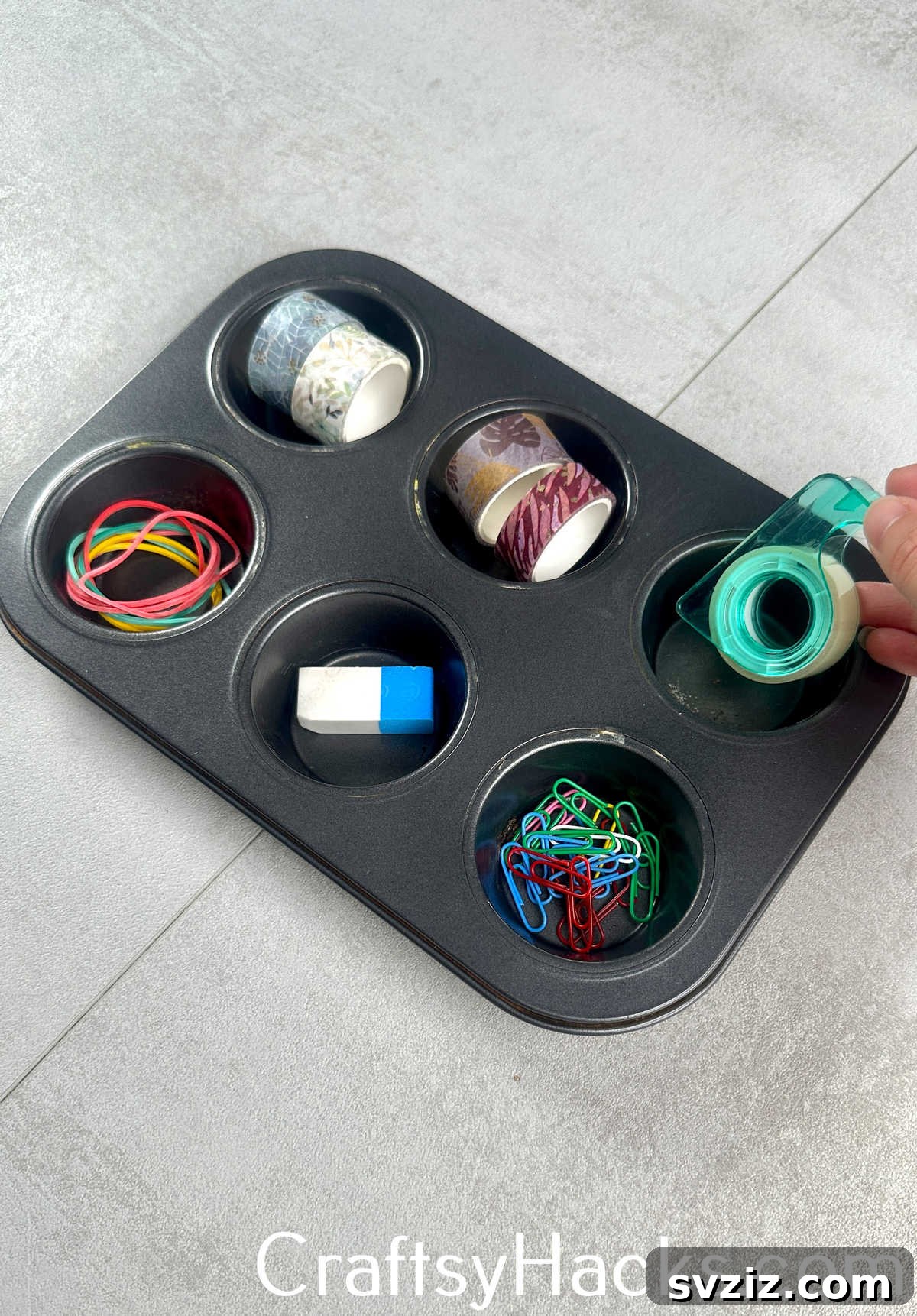 Organize desk drawers by using a muffin tin or muffin cups to sort small office supplies like paper clips, thumbtacks, and erasers.
