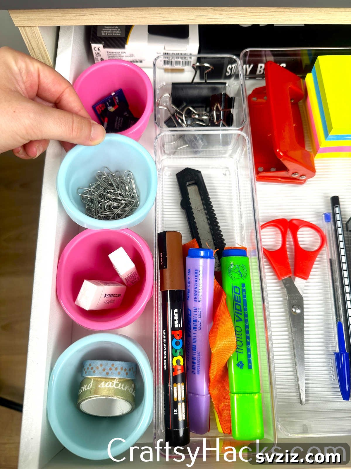 Organize small office supplies or craft items using colorful silicone cupcake liners as drawer dividers.