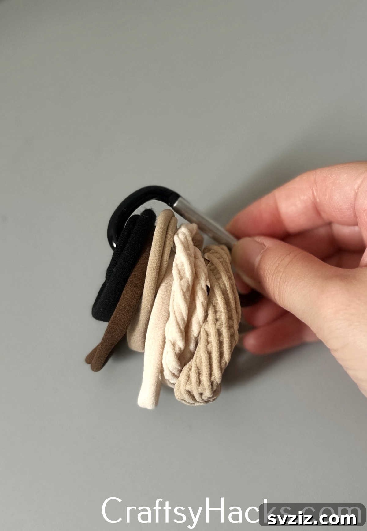 Keep all your hair ties in one place by clipping them onto a carabiner for easy access and organization.