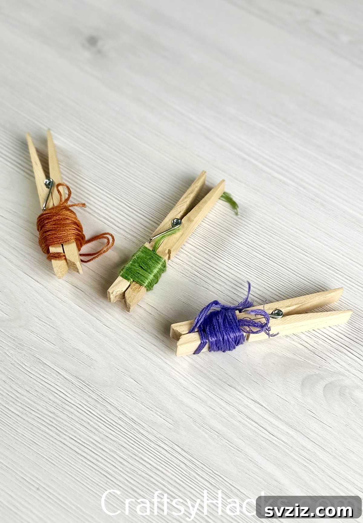 Neatly wrap and store small lengths of scrap yarn around clothespins to prevent tangles.